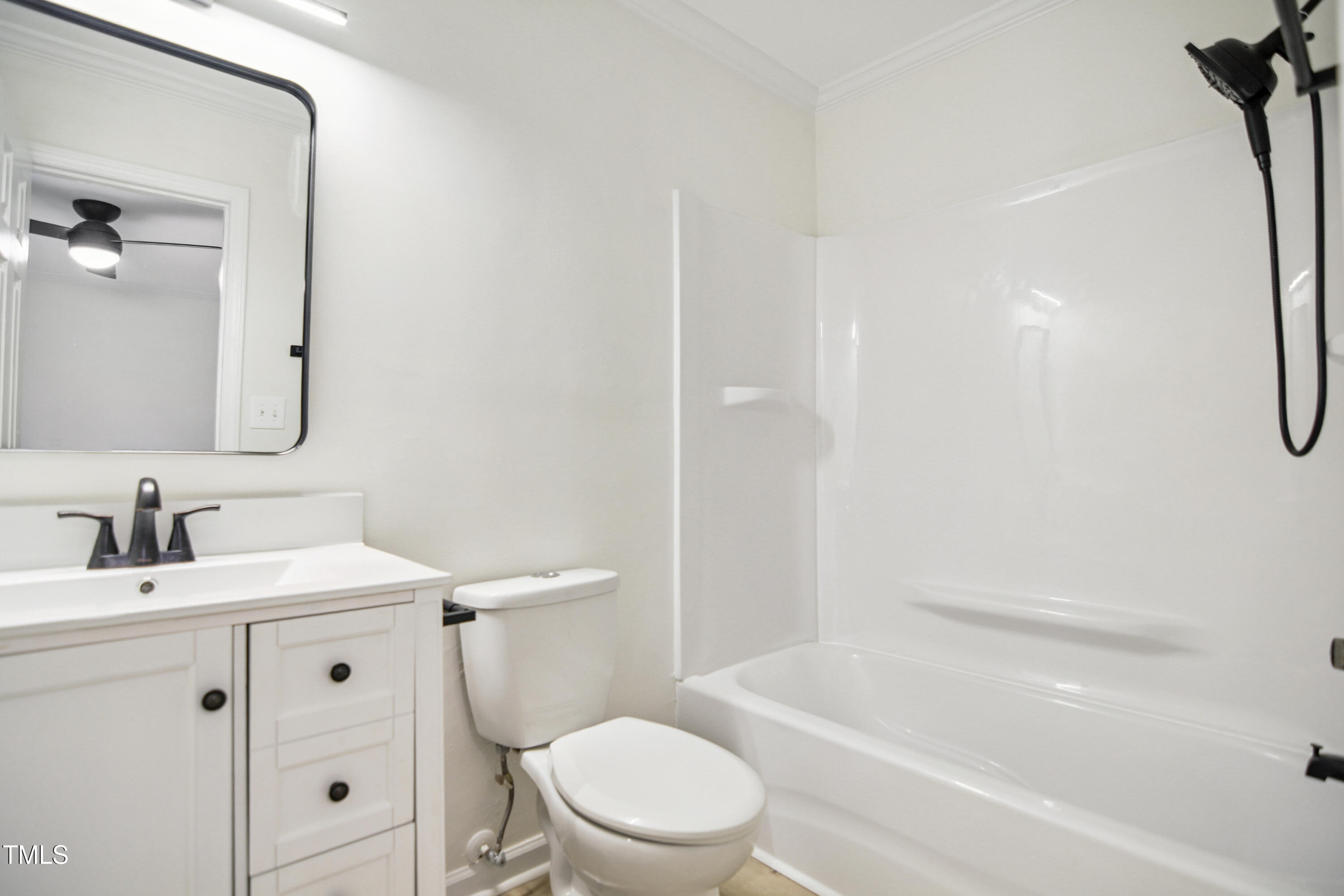 5436 Sharpe Drive Raleigh, NC 27612 - Photo 12 of 18 a bathroom with a sink a toilet and shower