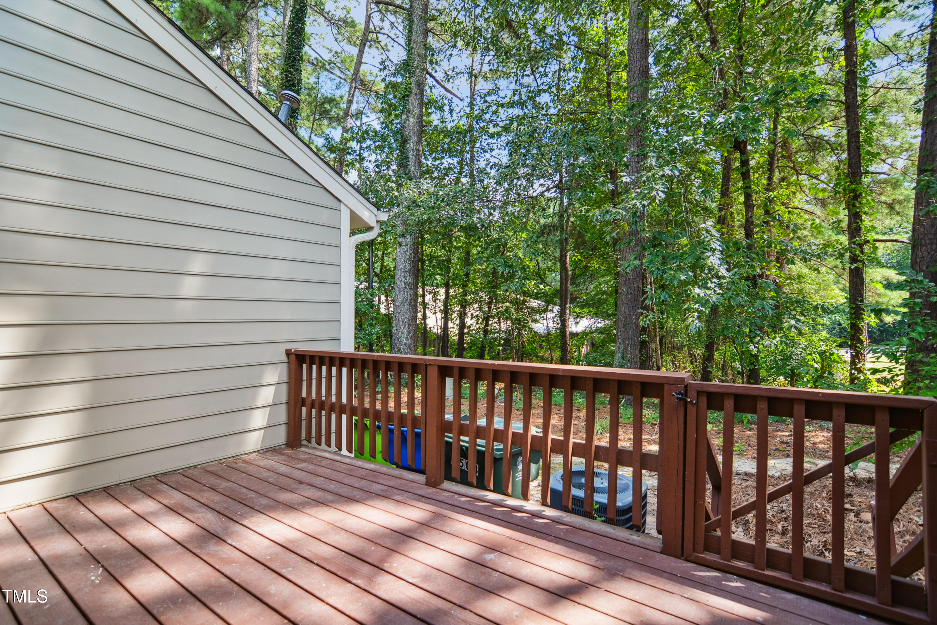 5436 Sharpe Drive Raleigh, NC 27612 - Photo 17 of 18 a view of a wooden roof deck
