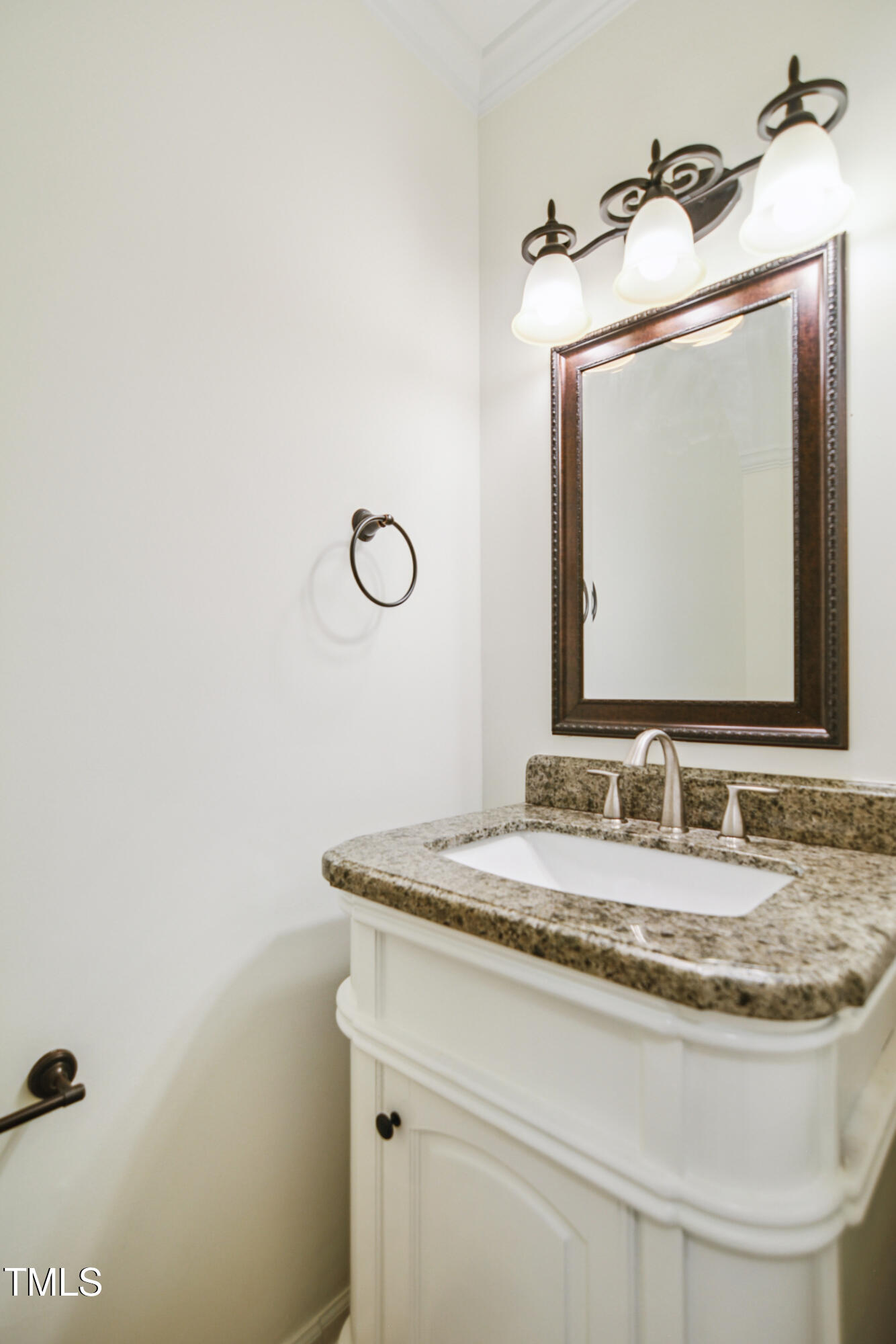5436 Sharpe Drive Raleigh, NC 27612 - Photo 9 of 18 a bathroom with a granite countertop sink and a mirror