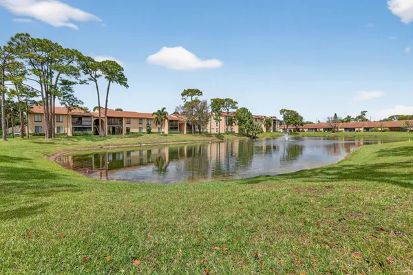 a view of a lake with houses in the back