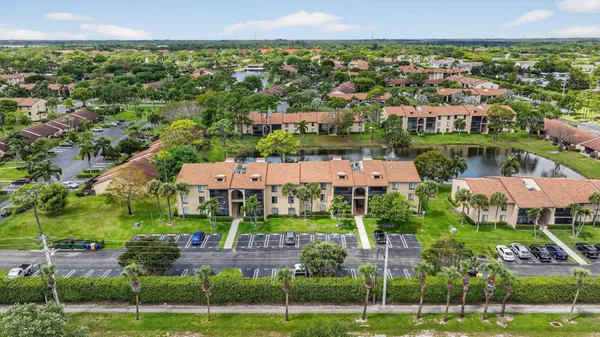 an aerial view of a houses with a garden