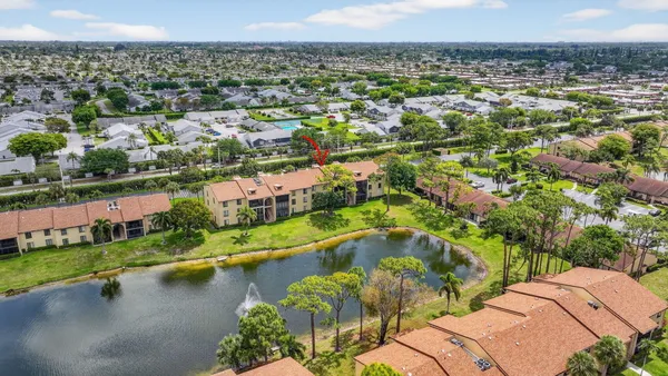a view of house with swimming pool and patio