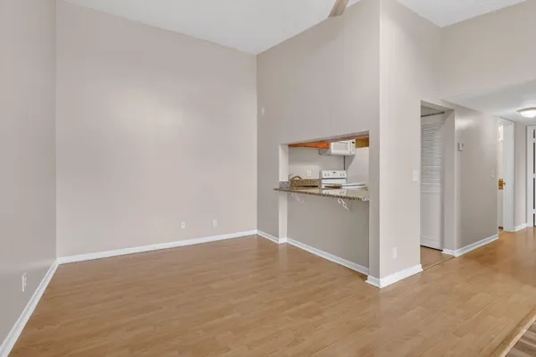 a view of a kitchen with refrigerator