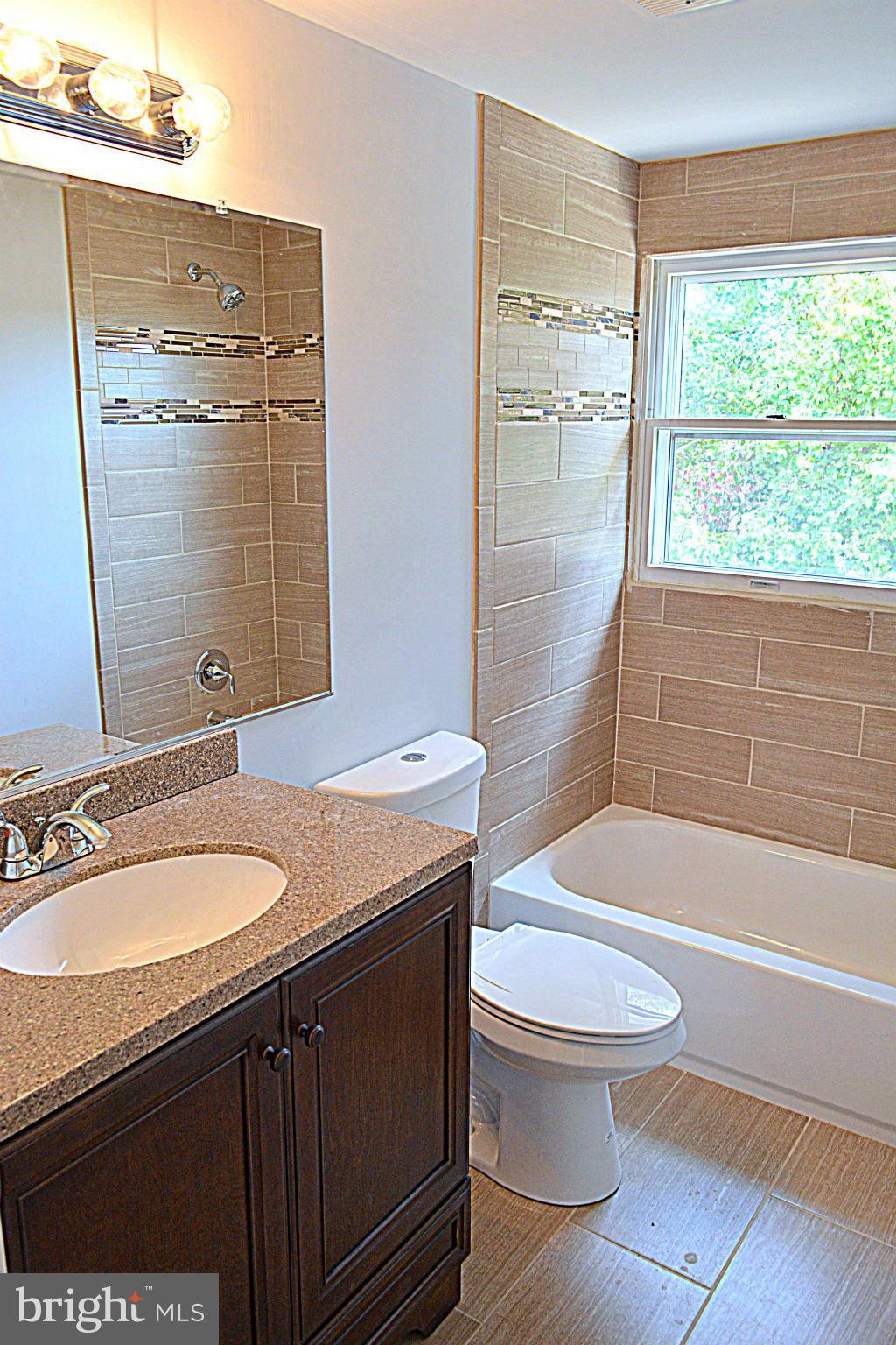 2085 Crouse Mill Road Taneytown, MD 21787 - Photo 7 of 19 a bathroom with a sink a toilet and shower
