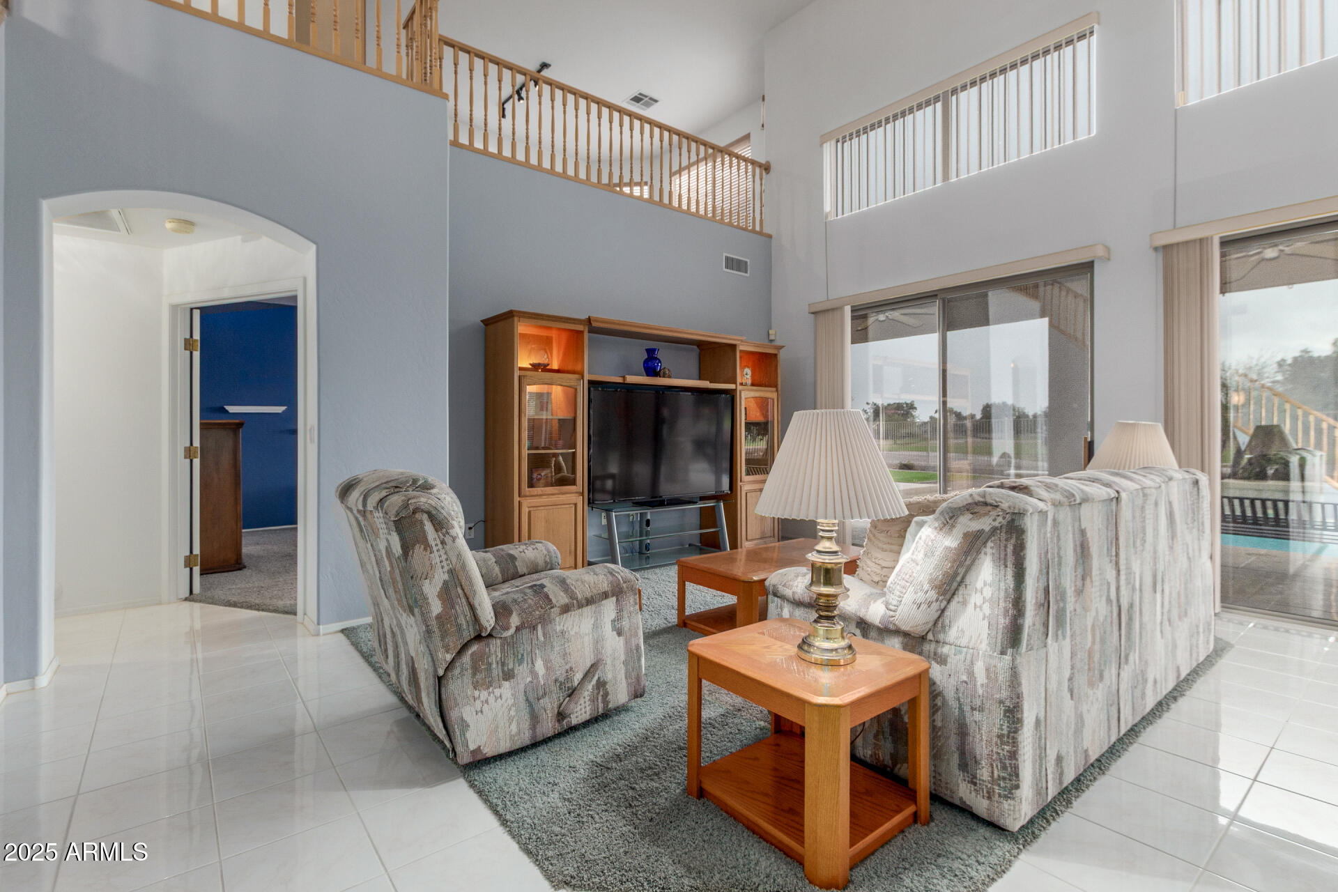 1111 South Sandstone Street Gilbert, AZ 85296 - Photo 11 of 59 a living room with furniture and a large window