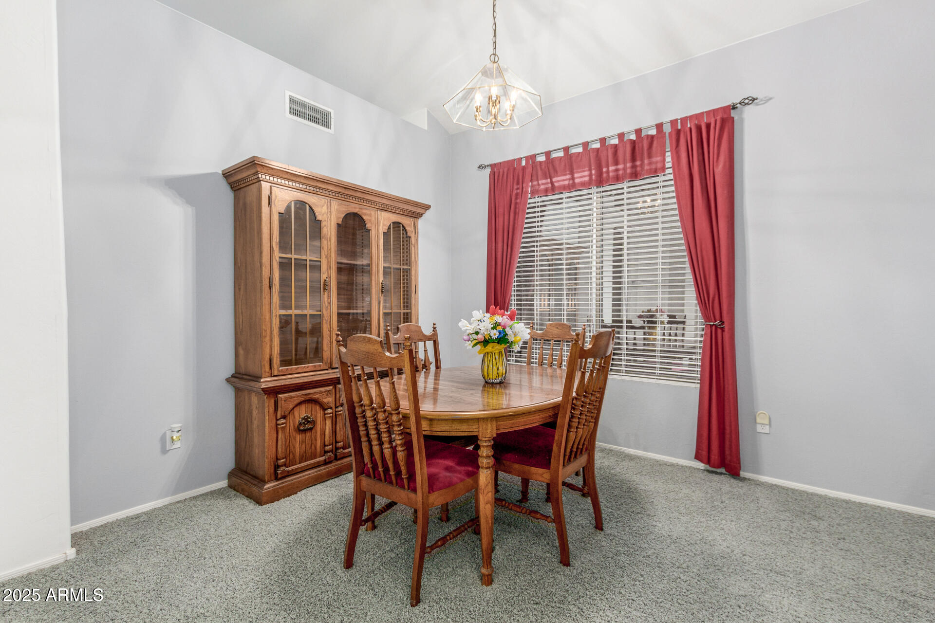 1111 South Sandstone Street Gilbert, AZ 85296 - Photo 12 of 59 a dining room with furniture a chandelier and window
