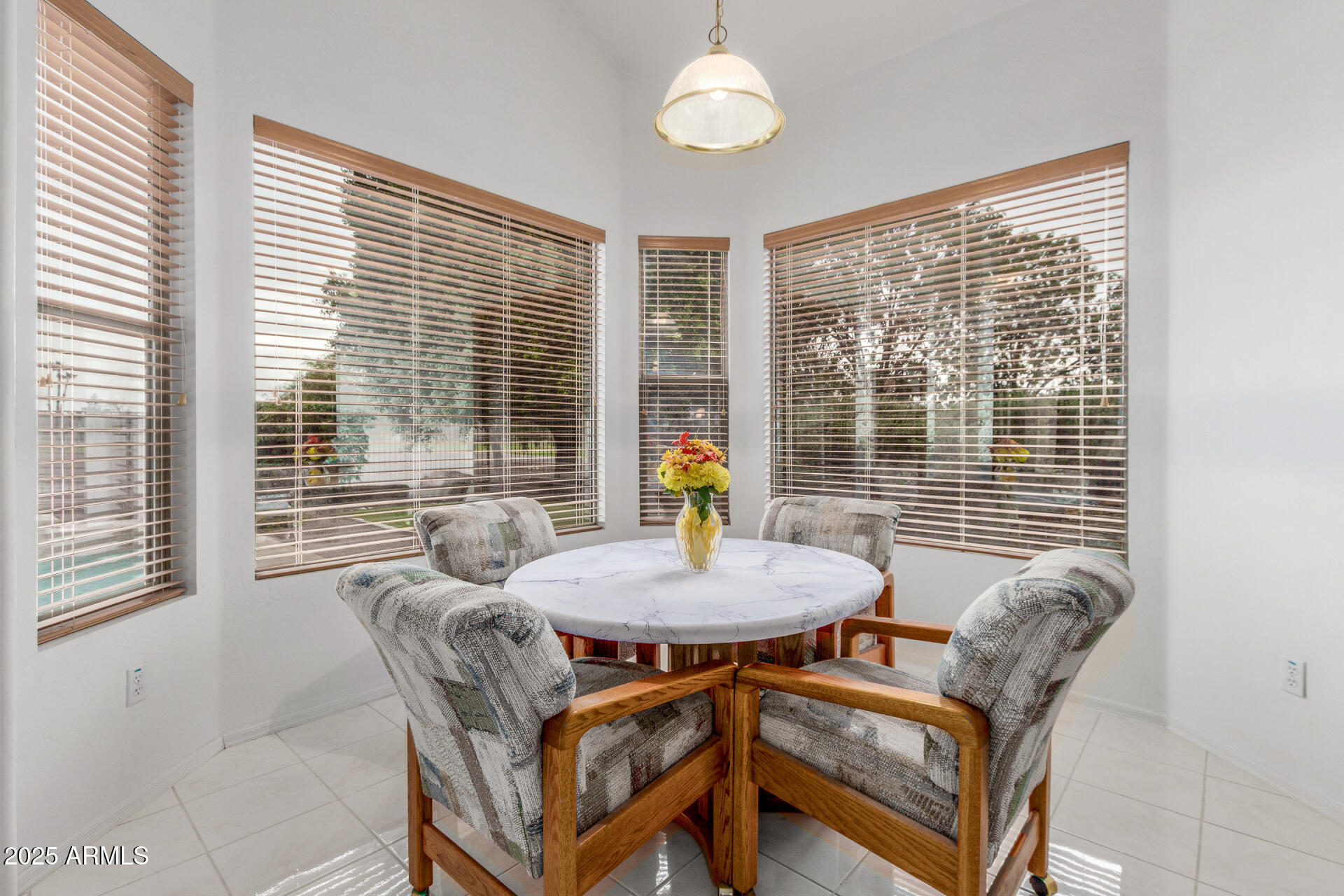 1111 South Sandstone Street Gilbert, AZ 85296 - Photo 13 of 59 a dining room with furniture and a floor to ceiling window