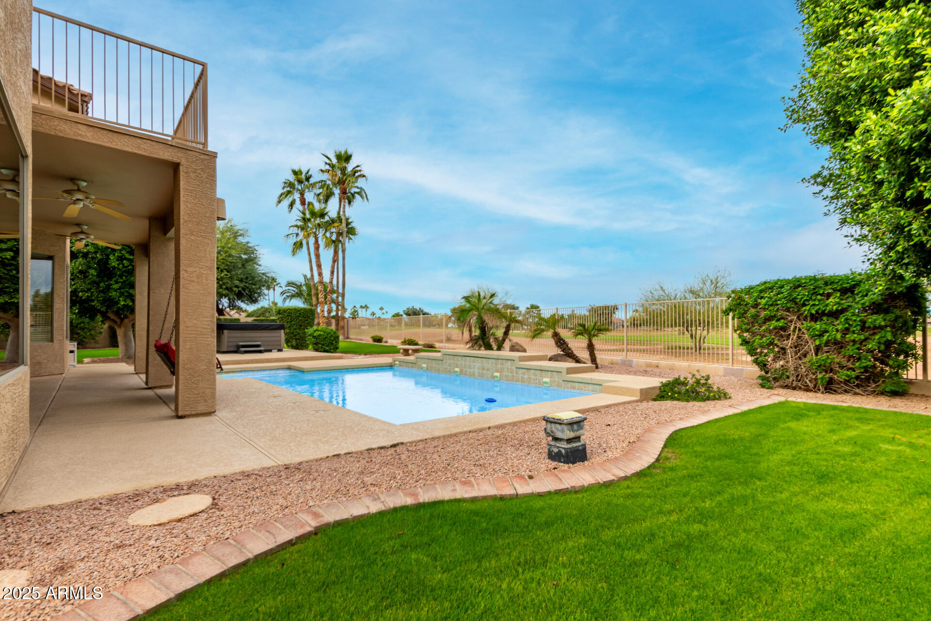 1111 South Sandstone Street Gilbert, AZ 85296 - Photo 41 of 59 a view of a house with a swimming pool and a yard