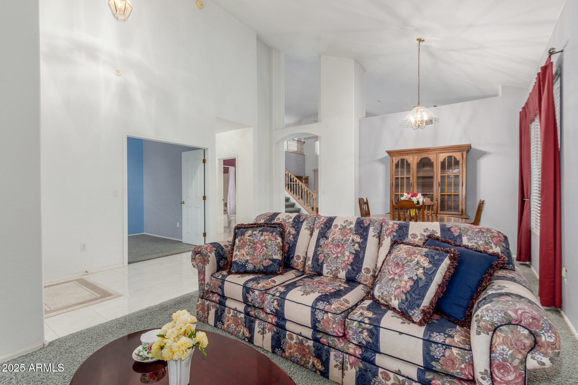 1111 South Sandstone Street Gilbert, AZ 85296 - Photo 8 of 59 a living room with furniture chandelier and a window