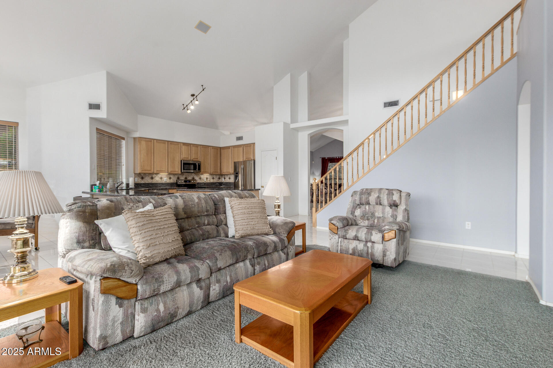 1111 South Sandstone Street Gilbert, AZ 85296 - Photo 10 of 59 a living room with furniture and a chandelier