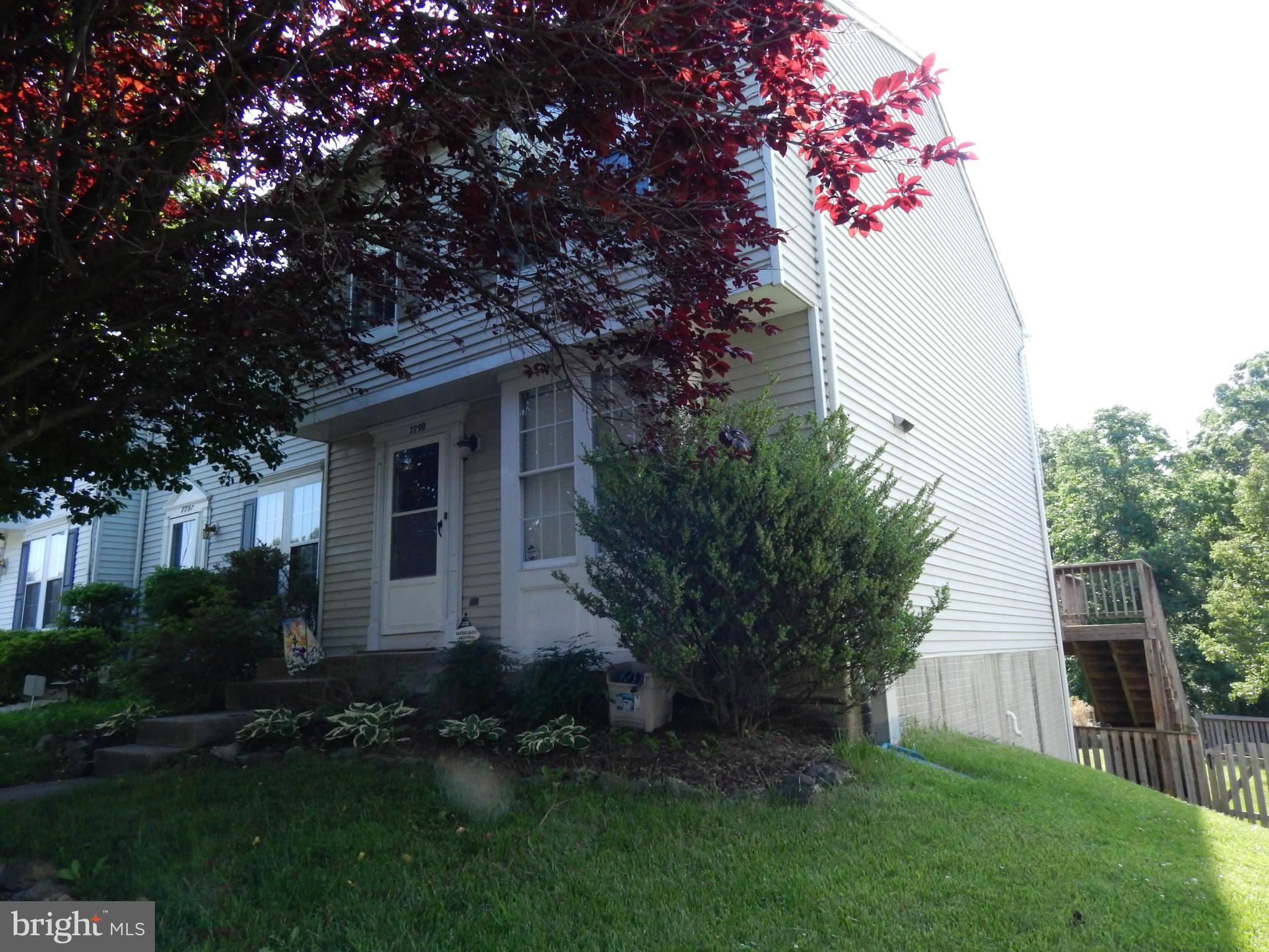7799 Paddock Way Baltimore, MD 21244 - Photo 1 of 27 a front view of house with a garden
