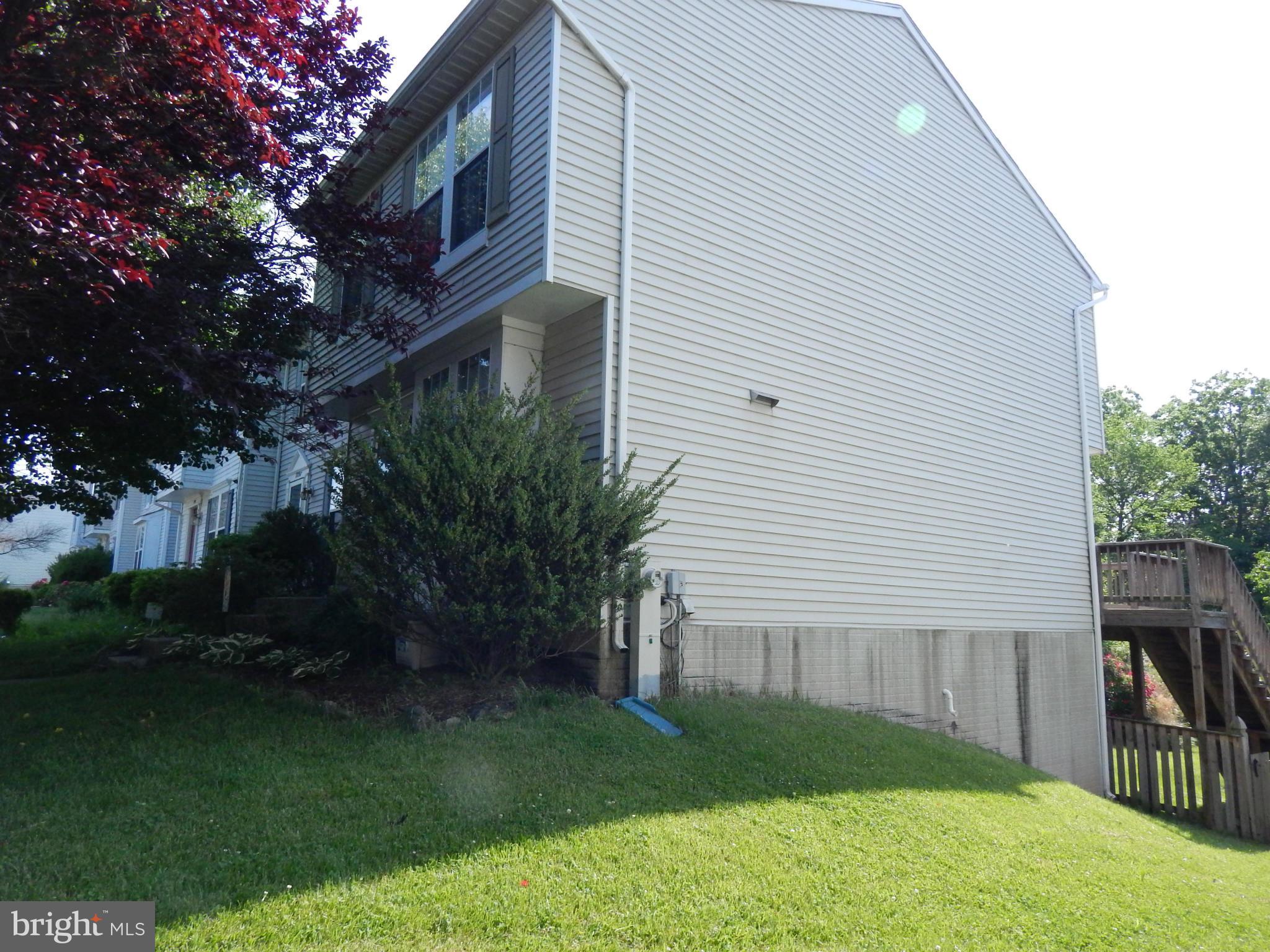 7799 Paddock Way Baltimore, MD 21244 - Photo 2 of 27 a view of a house with backyard and a tree