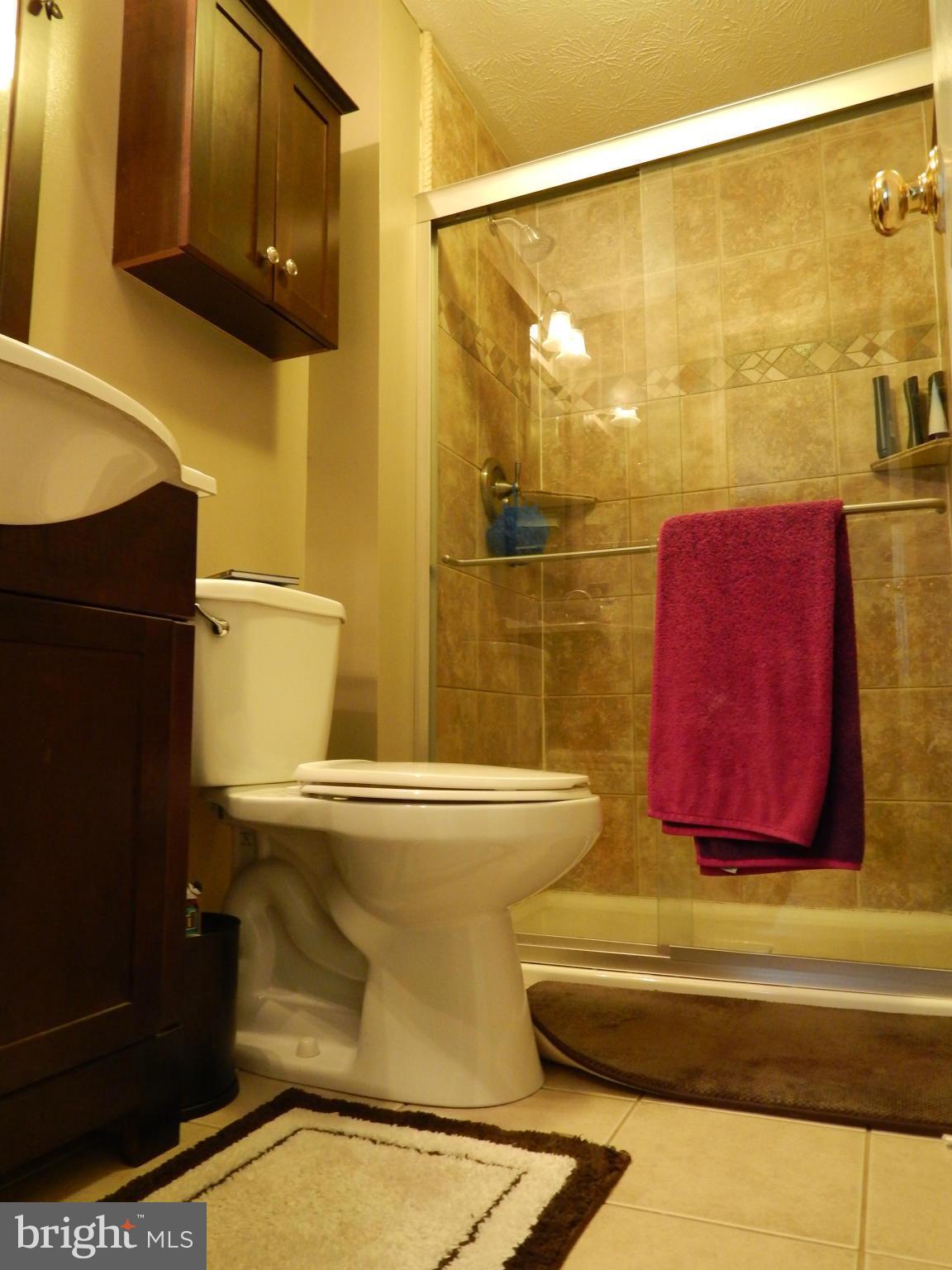 7799 Paddock Way Baltimore, MD 21244 - Photo 11 of 27 a bathroom with a sink and a mirror