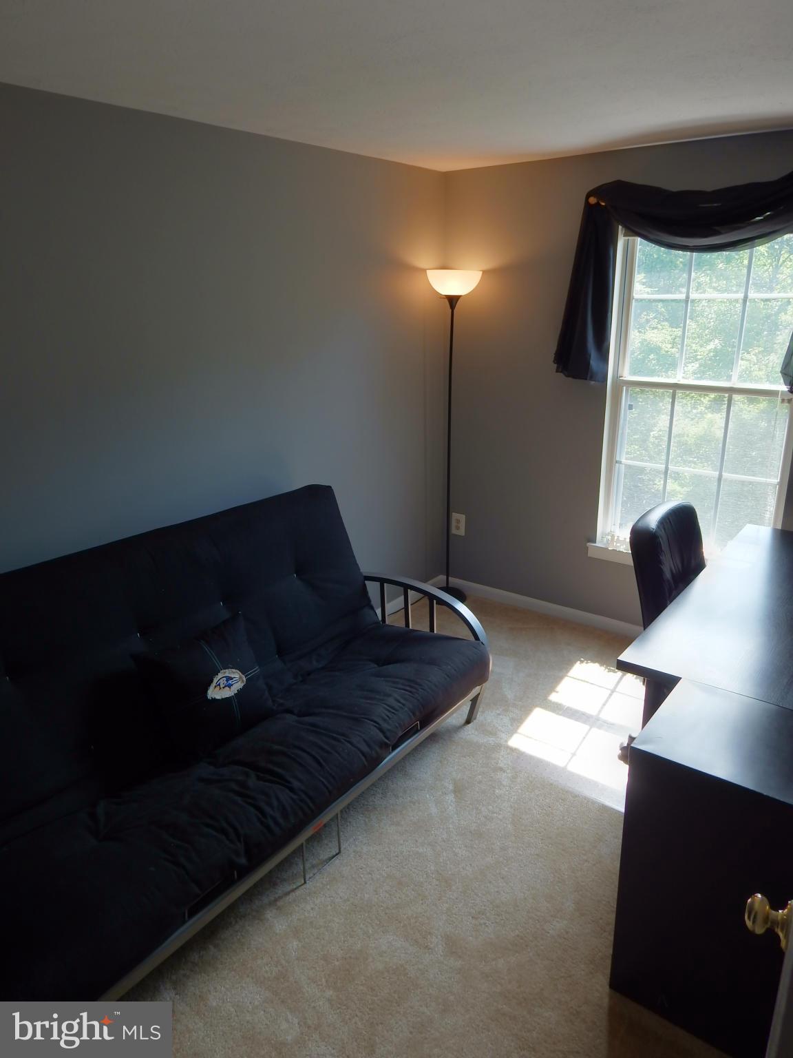 7799 Paddock Way Baltimore, MD 21244 - Photo 15 of 27 a living room with furniture and a lamp