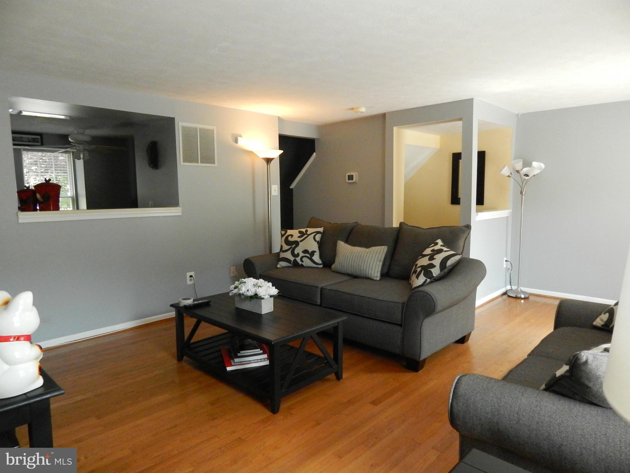 7799 Paddock Way Baltimore, MD 21244 - Photo 17 of 27 a living room with furniture and wooden floor