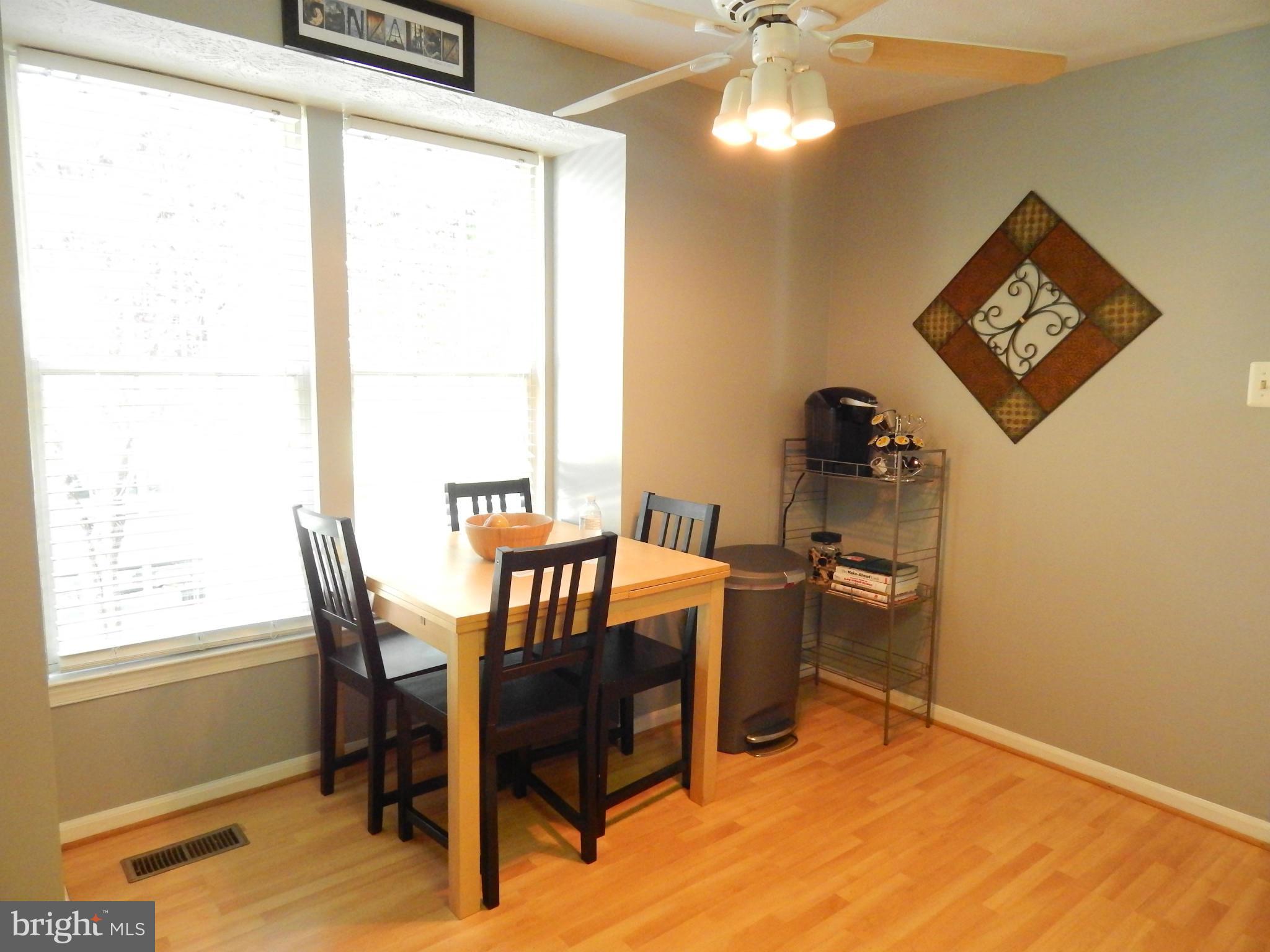7799 Paddock Way Baltimore, MD 21244 - Photo 23 of 27 a dining room with furniture and window