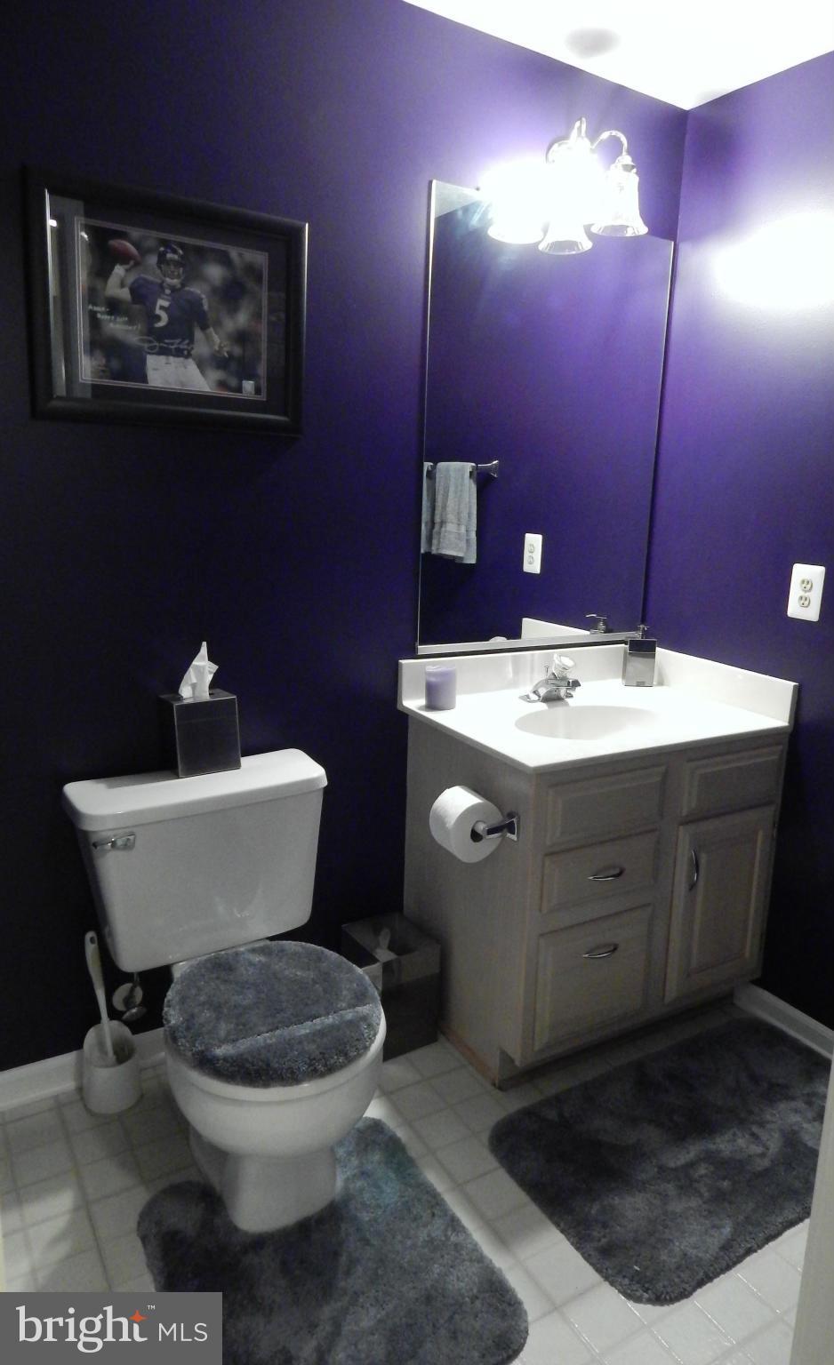 7799 Paddock Way Baltimore, MD 21244 - Photo 25 of 27 a bathroom with a toilet a sink and mirror