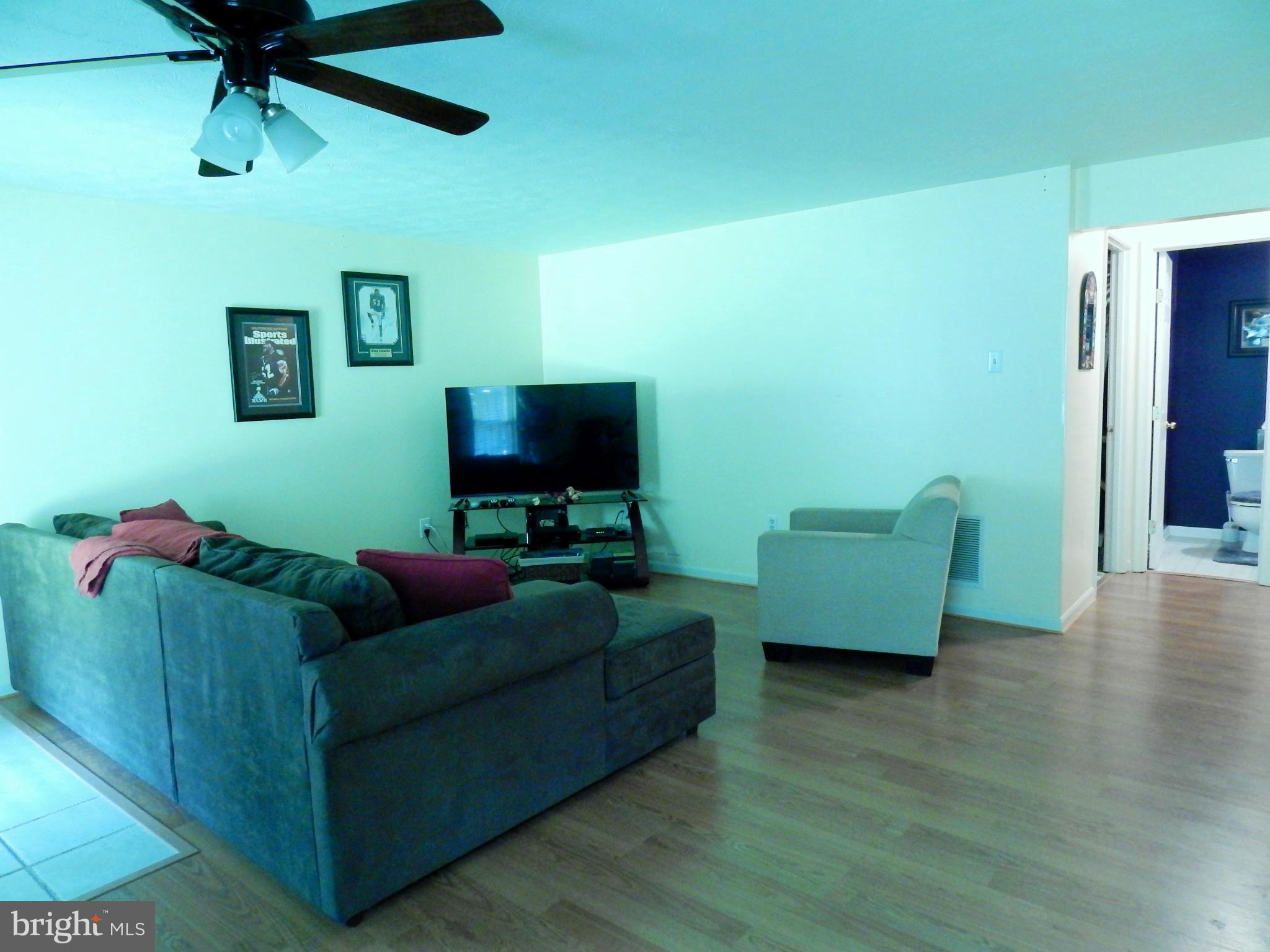 7799 Paddock Way Baltimore, MD 21244 - Photo 26 of 27 a living room with furniture and a flat screen tv