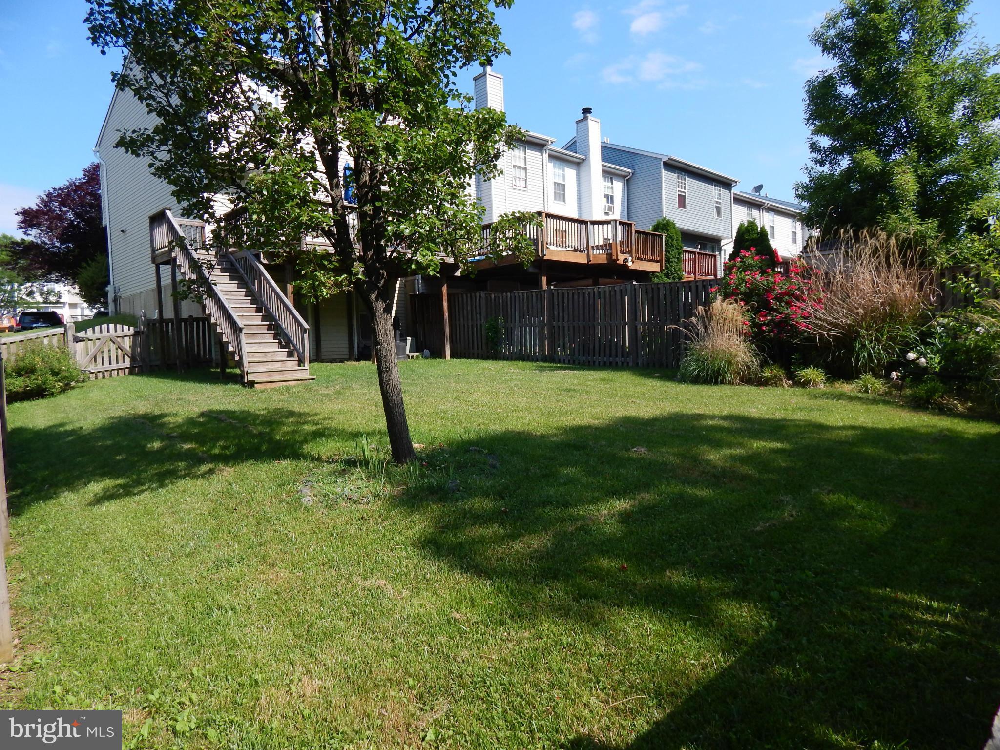 7799 Paddock Way Baltimore, MD 21244 - Photo 5 of 27 a view of a backyard of the house