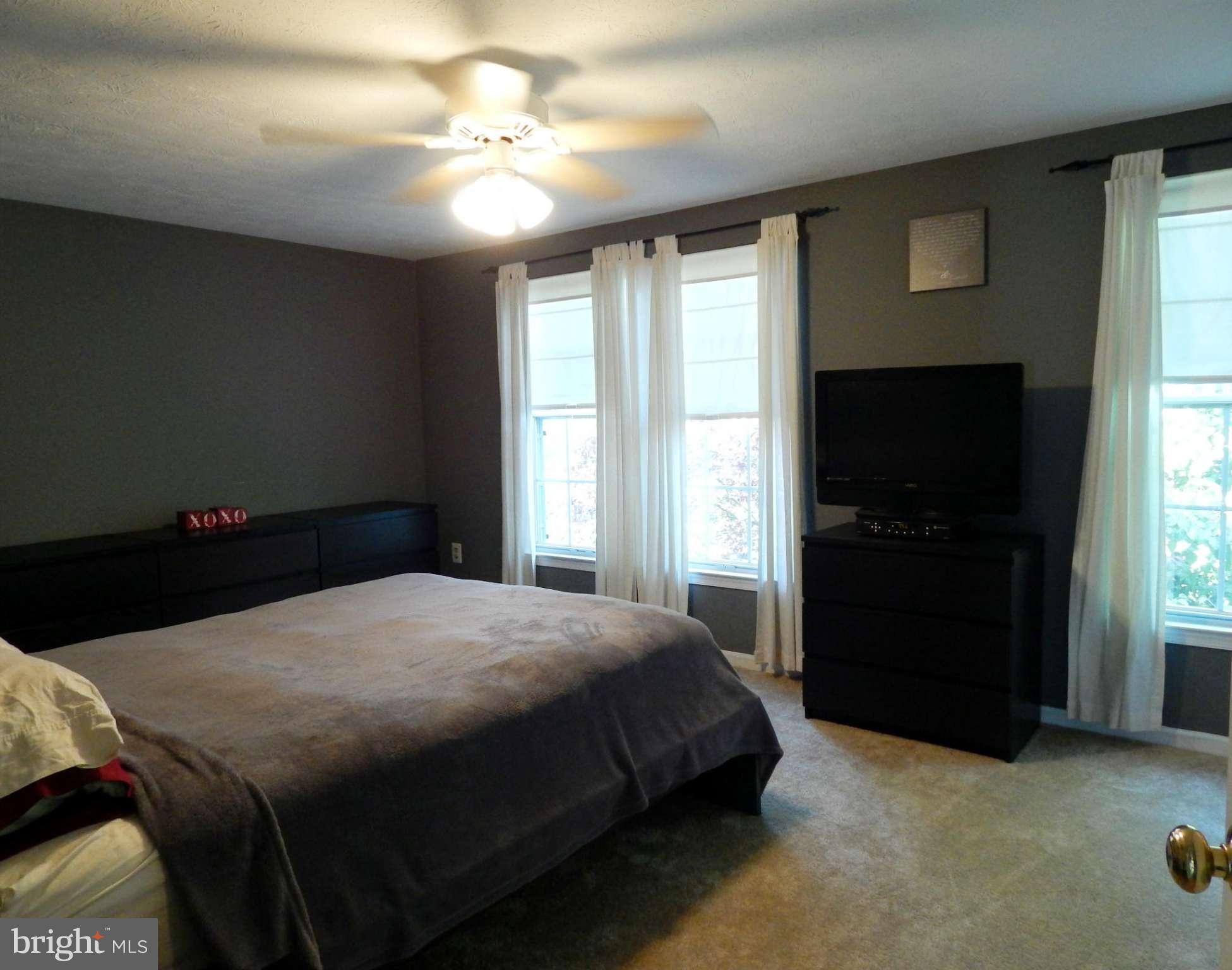 7799 Paddock Way Baltimore, MD 21244 - Photo 6 of 27 a bedroom with a bed and a window