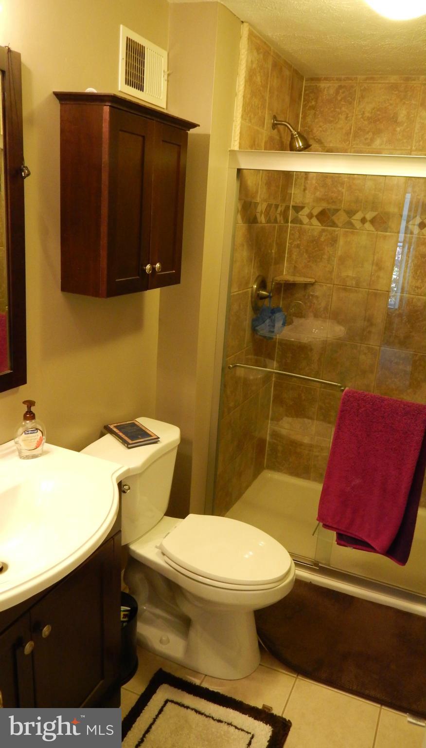 7799 Paddock Way Baltimore, MD 21244 - Photo 9 of 27 a bathroom with a toilet and a shower
