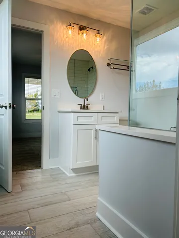 a bathroom with a shower and a bathtub