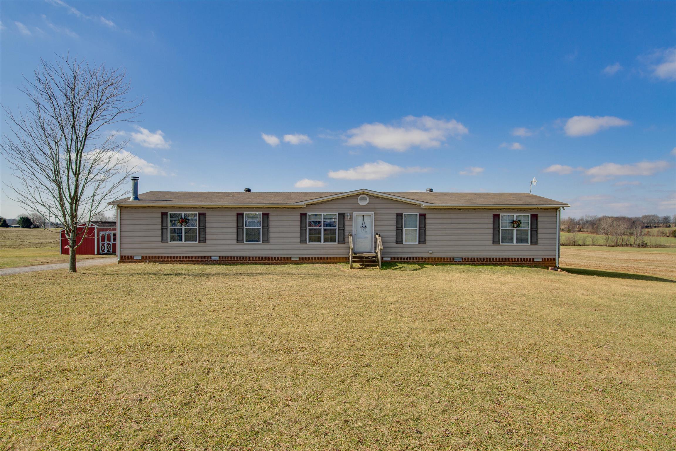 6562 Brewer Road Portland, TN 37148 - Photo 28 of 30 a front view of a house with a garden