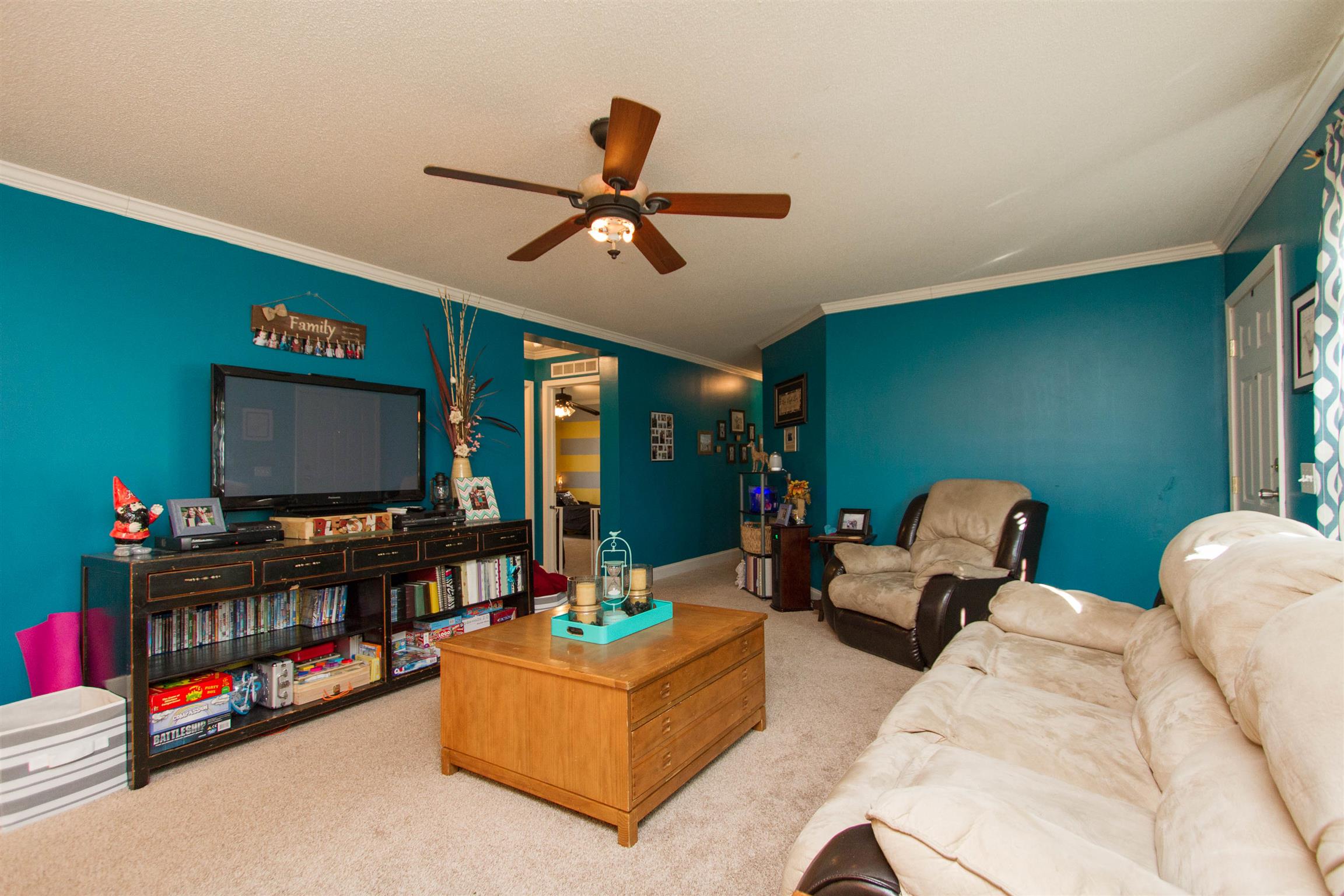 6562 Brewer Road Portland, TN 37148 - Photo 3 of 30 a living room with furniture and a flat screen tv