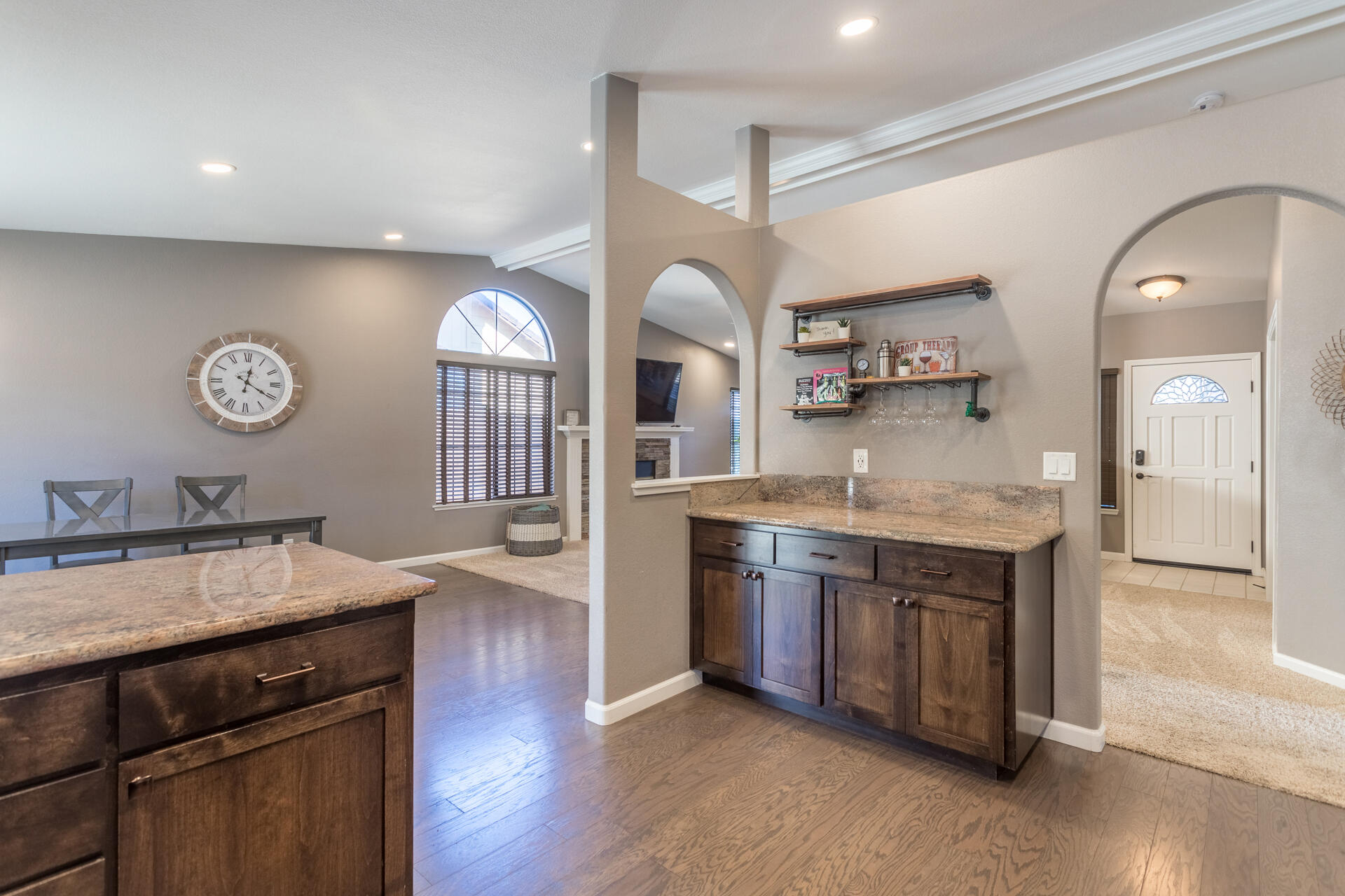6582 Hemlock Street Redding, CA 96001 - Photo 13 of 35 a kitchen with granite countertop a stove a sink and a wooden floors