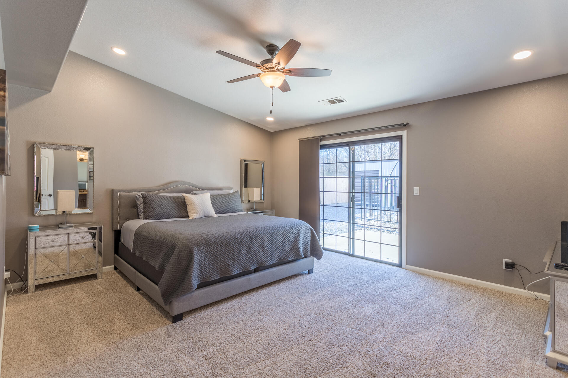6582 Hemlock Street Redding, CA 96001 - Photo 14 of 35 a spacious bedroom with a bed and window