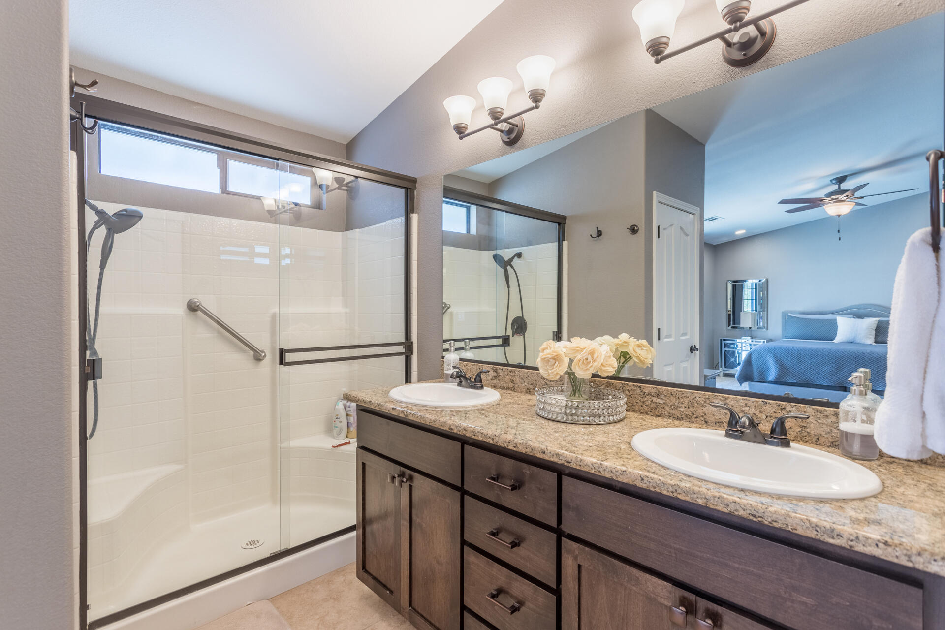 6582 Hemlock Street Redding, CA 96001 - Photo 16 of 35 a bathroom with double vanity sinks and a mirror
