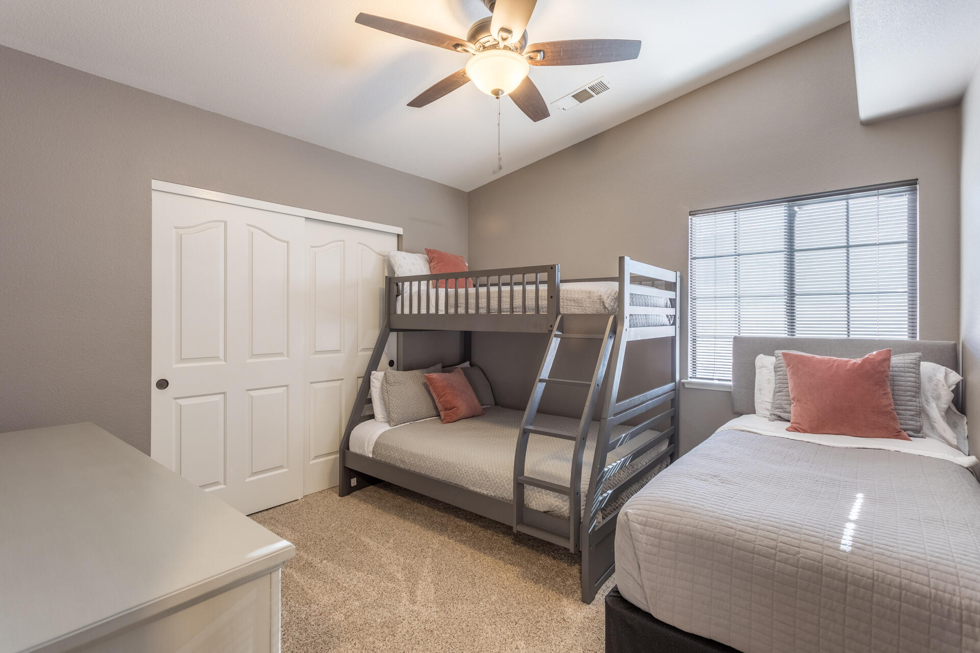 6582 Hemlock Street Redding, CA 96001 - Photo 18 of 35 a bedroom with a bed and a chandelier