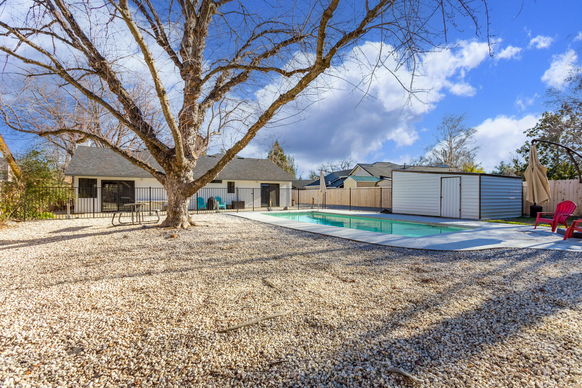 6582 Hemlock Street Redding, CA 96001 - Photo 23 of 35 a front view of a house with a yard and garage