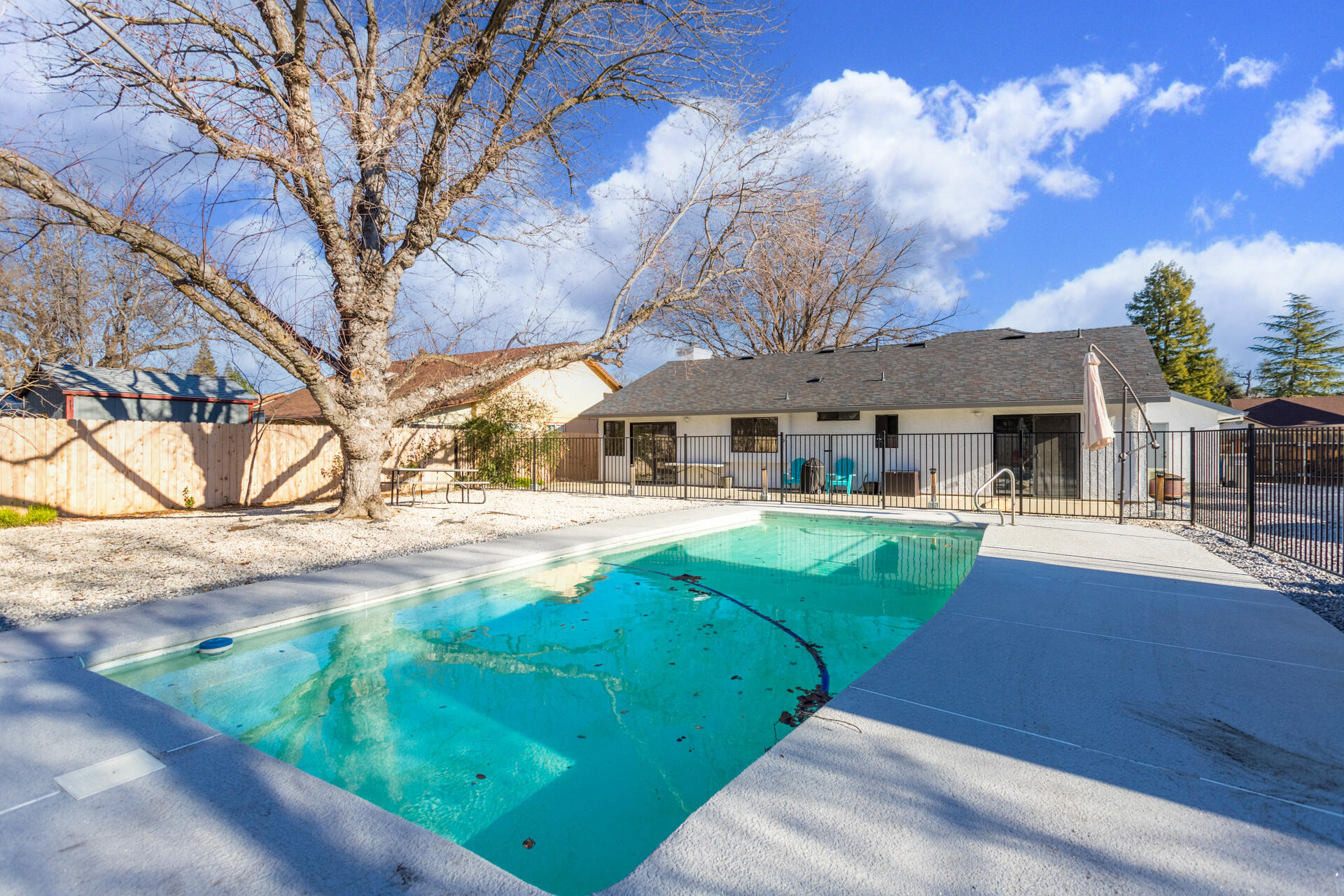 6582 Hemlock Street Redding, CA 96001 - Photo 24 of 35 a front view of a house with garden