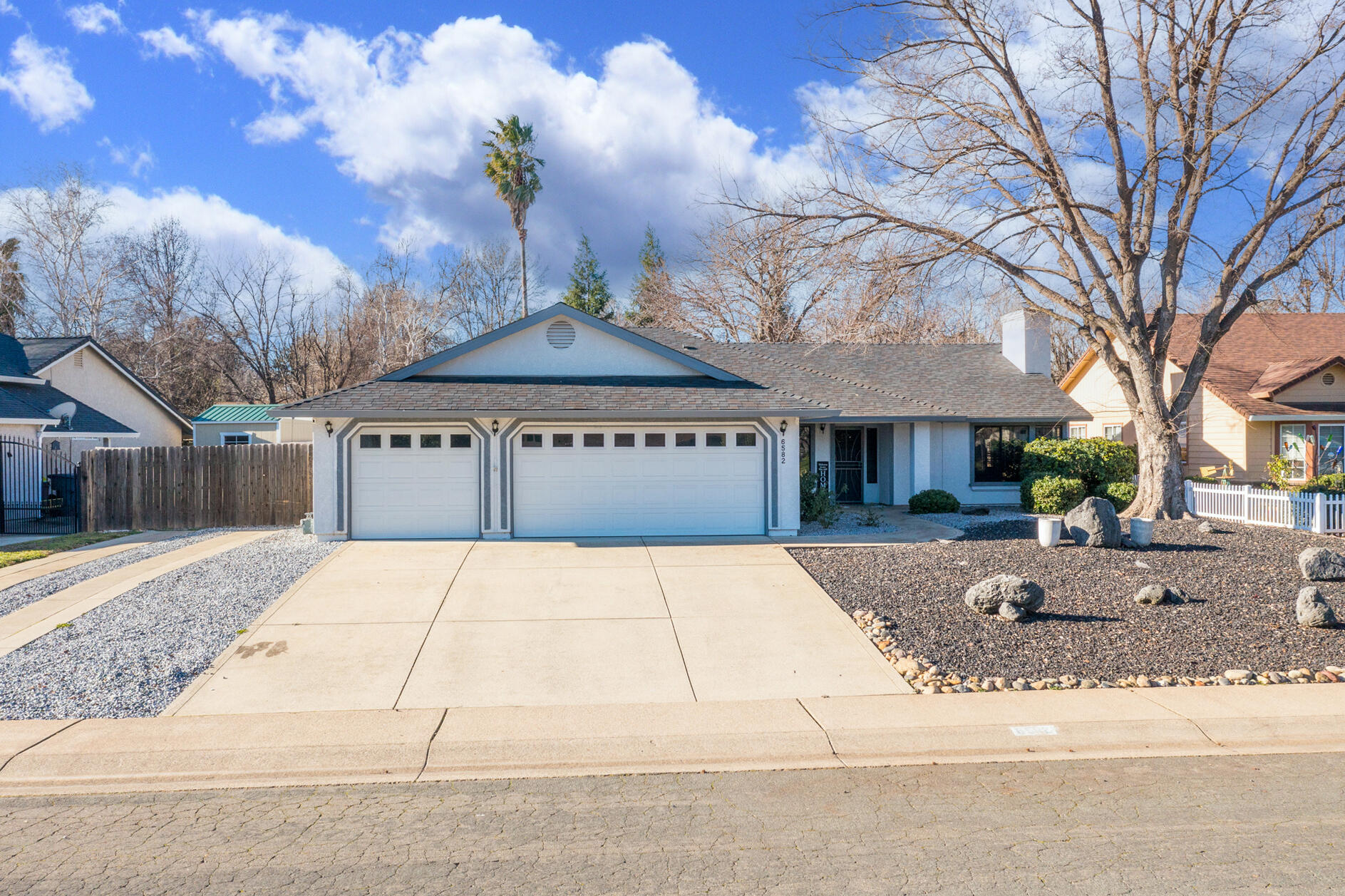 6582 Hemlock Street Redding, CA 96001 - Photo 30 of 35 a view of a house with a yard and tree s
