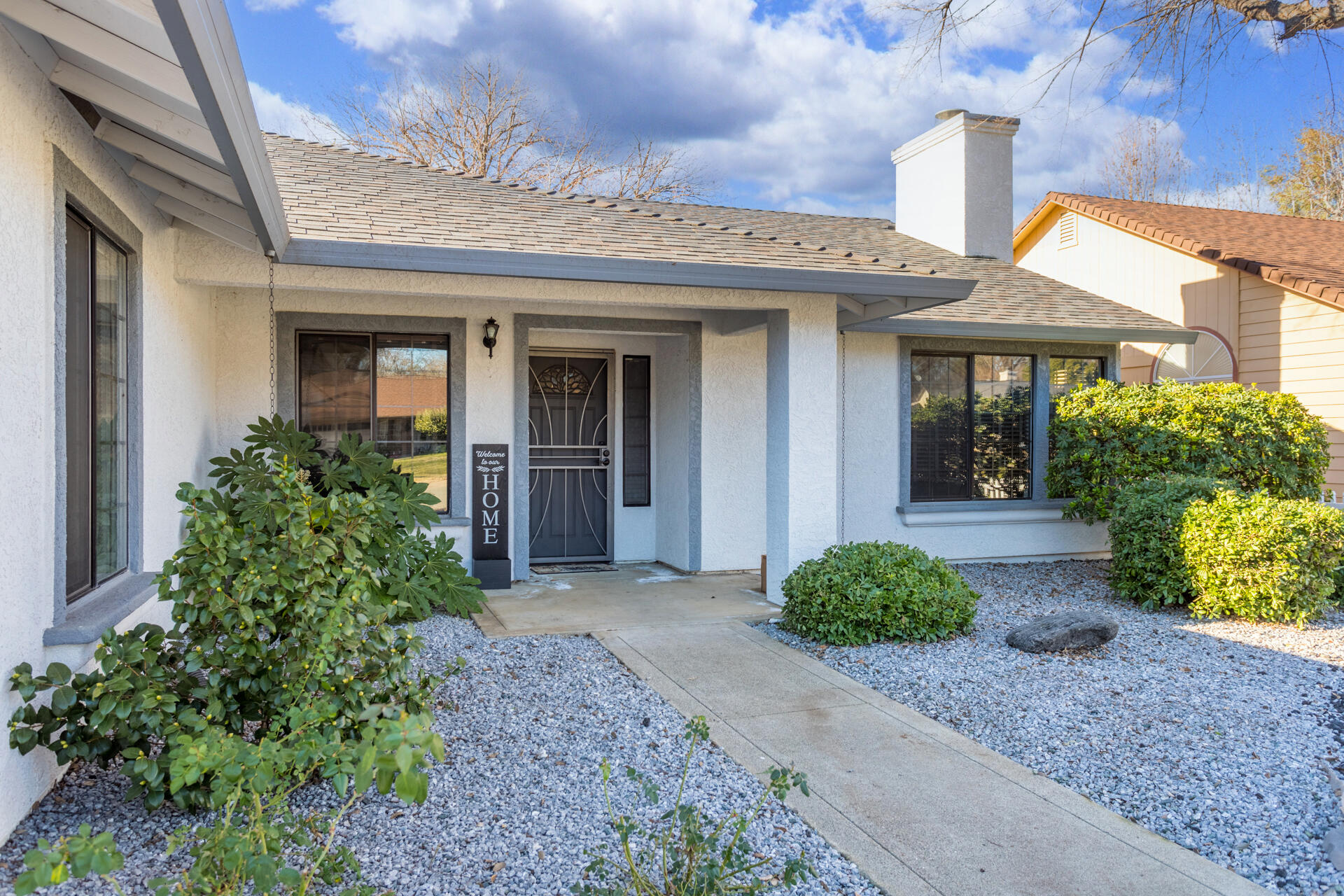 6582 Hemlock Street Redding, CA 96001 - Photo 3 of 35 a view of a house with potted plants