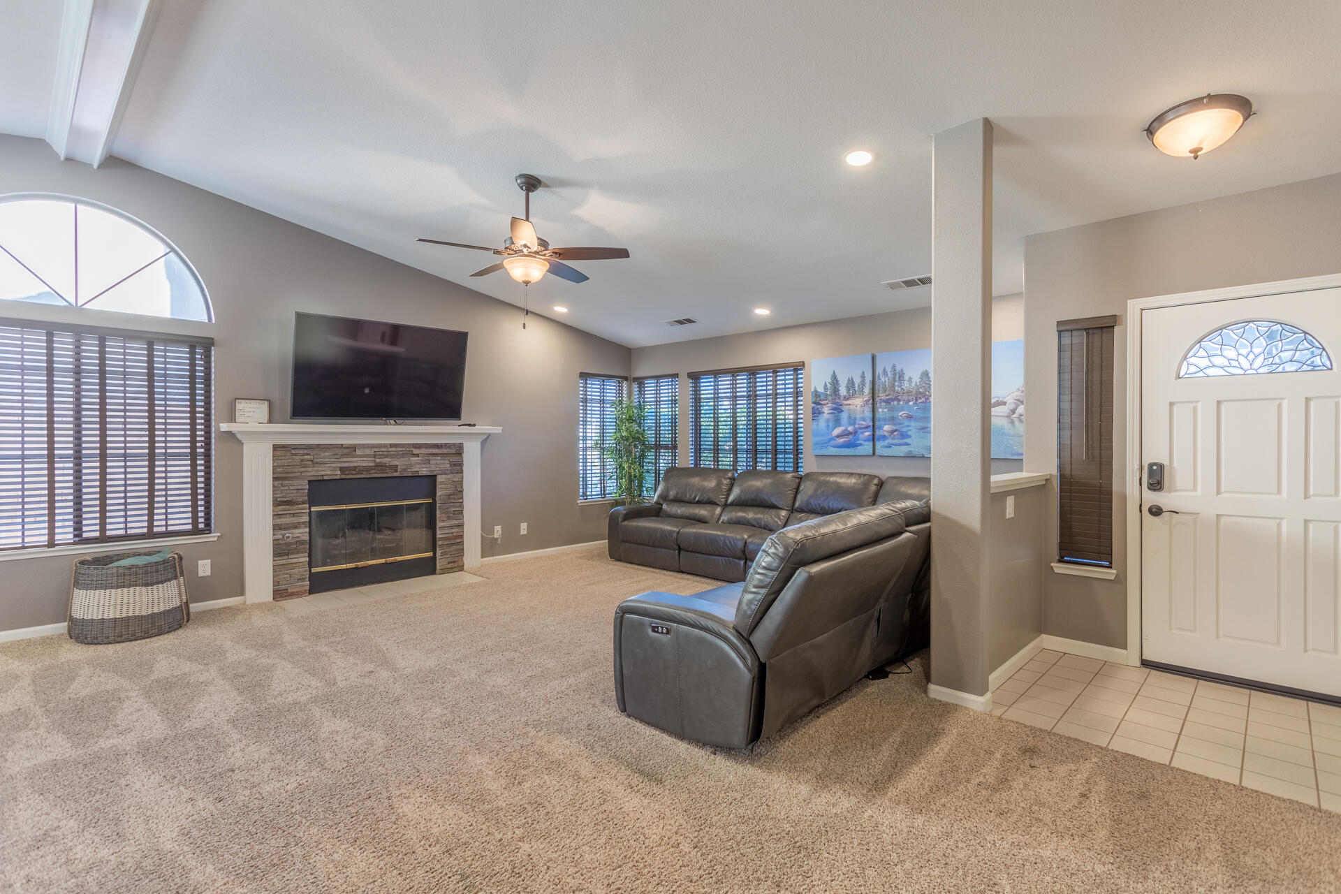 6582 Hemlock Street Redding, CA 96001 - Photo 5 of 35 a living room with furniture a fireplace and a flat screen tv
