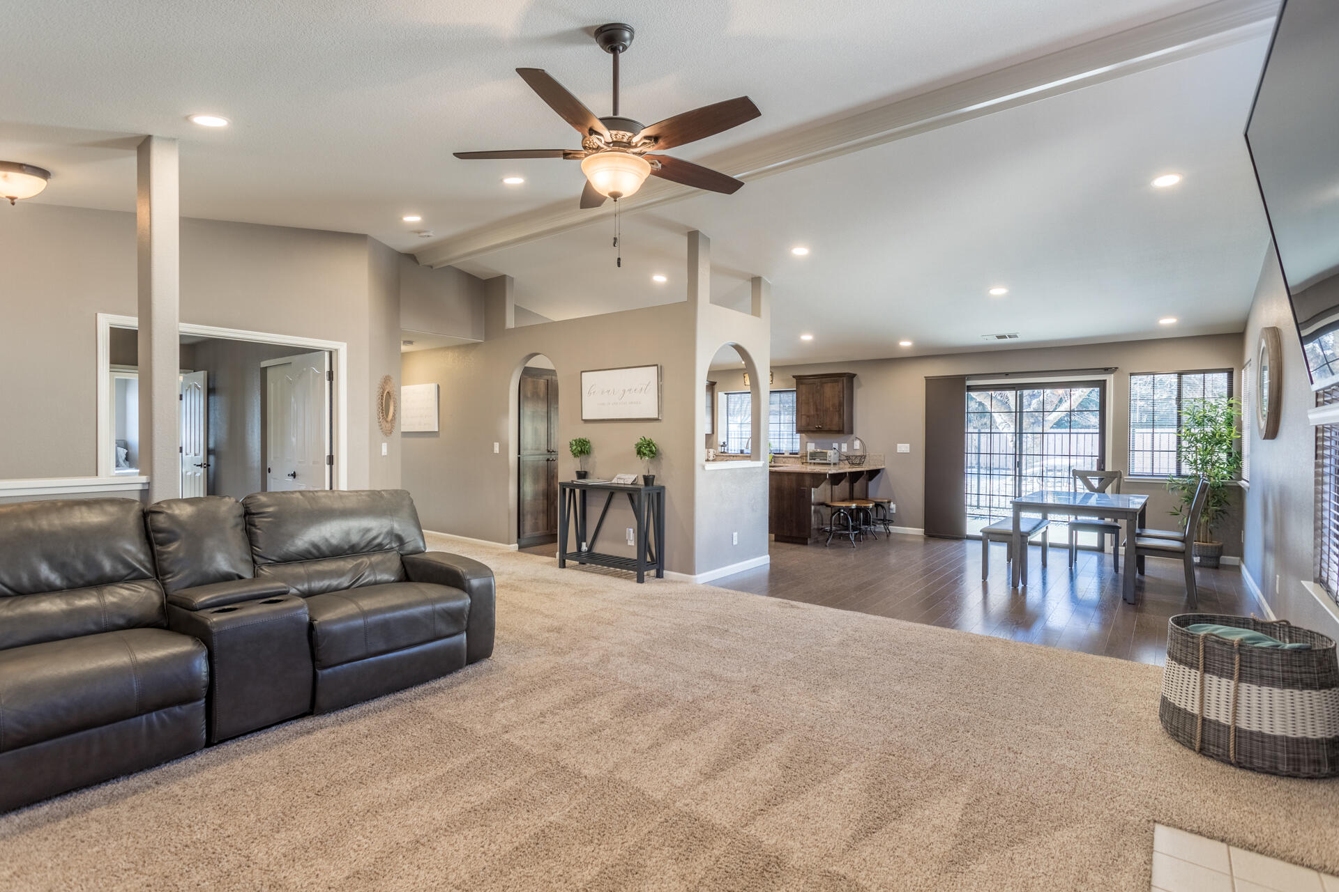 6582 Hemlock Street Redding, CA 96001 - Photo 8 of 35 a living room with furniture kitchen area and a chandelier