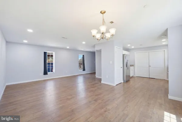 a view of a livingroom with wooden floor
