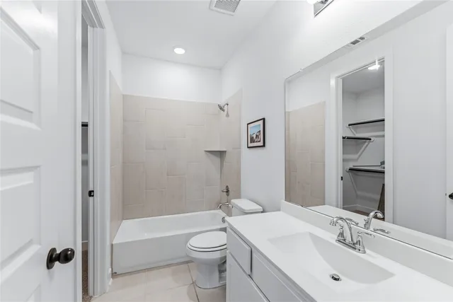 a bathroom with a toilet a sink and a bathtub