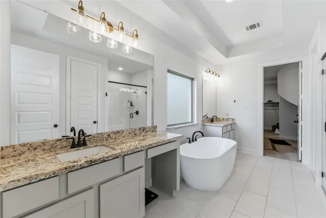 a bathroom with a sink double vanity and a mirror