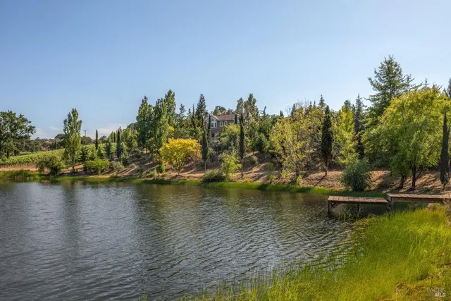 a kitchen with a stove a sink and a refrigerator