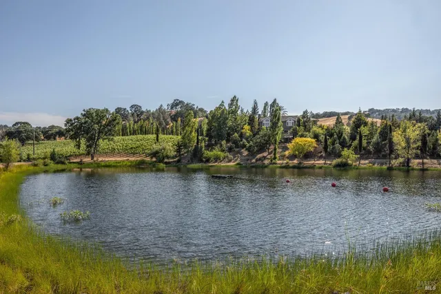 a kitchen with granite countertop lots of counter top space and windows
