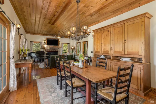 a bedroom with furniture and a large window