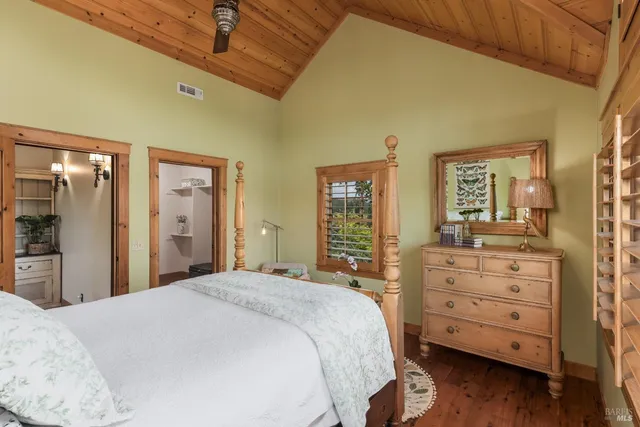 a street sign that is sitting in the forest