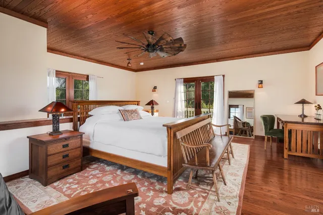 a white bath tub sitting in a bathroom next to a window