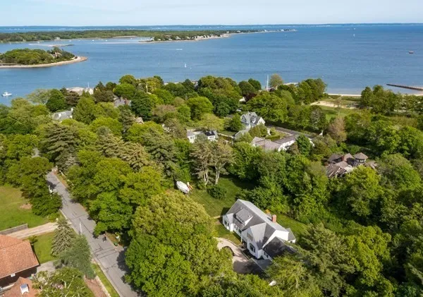 an aerial view of a house with lake view