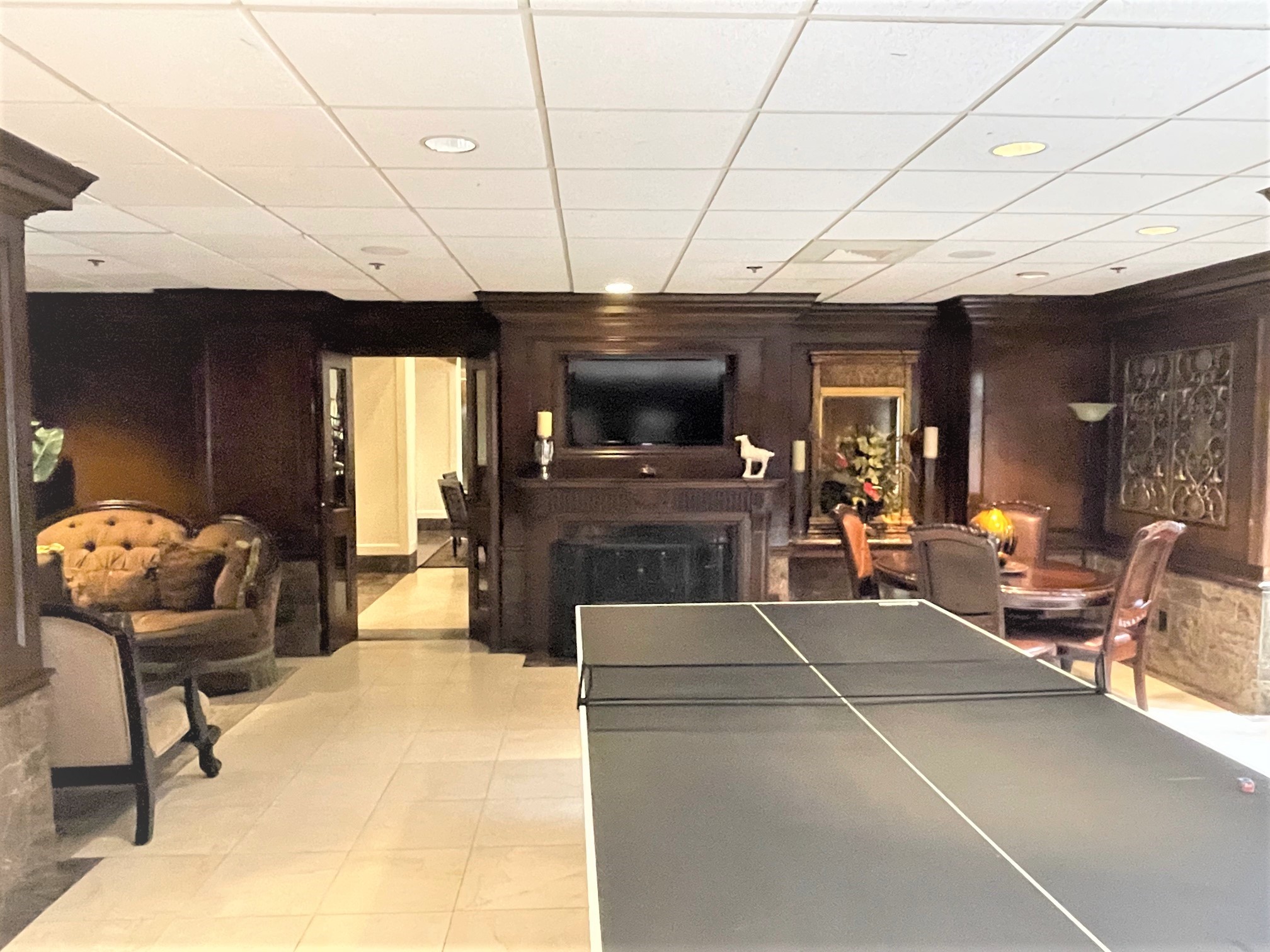 3525 Sage Road, Unit 404 Houston, TX 77056 - Photo 3 of 42 Club room table tennis and fireplace