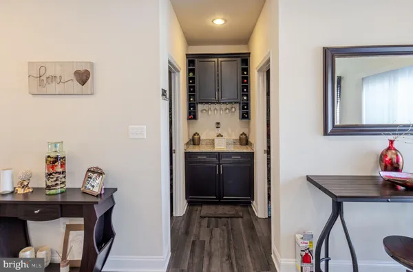 a kitchen with stainless steel appliances kitchen island granite countertop a refrigerator and a stove