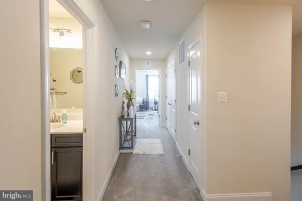 a view of a hallway with washer and dryer